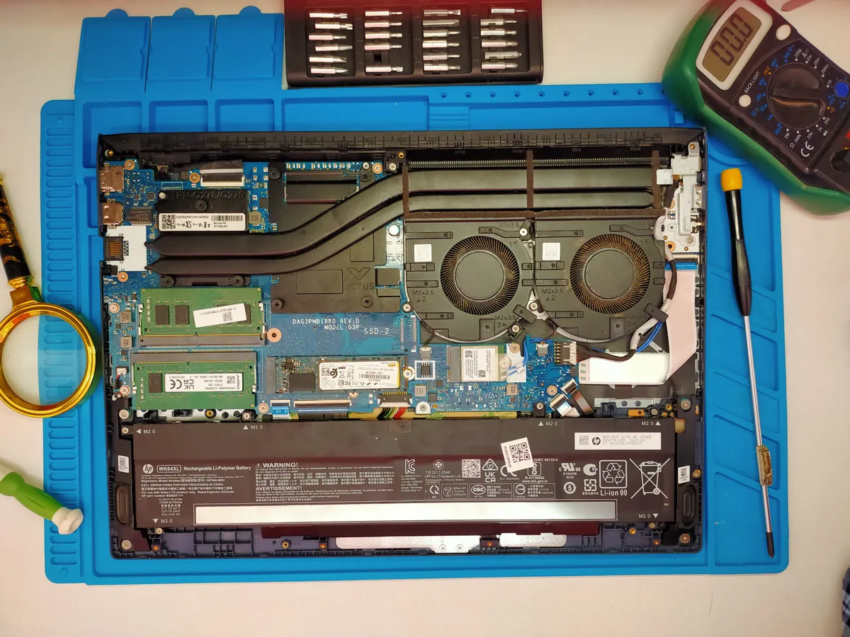 Laptop opened for internal service on the LAPTOP MASTER repair mat